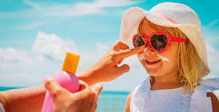 Image of Child getting Sunscreen Applied on Face