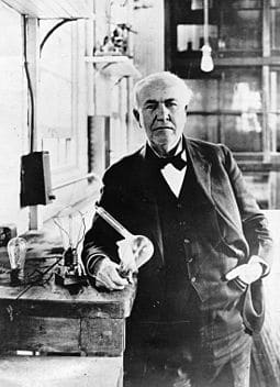 Thomas Alva Edison with light bulb invented using the scientific method